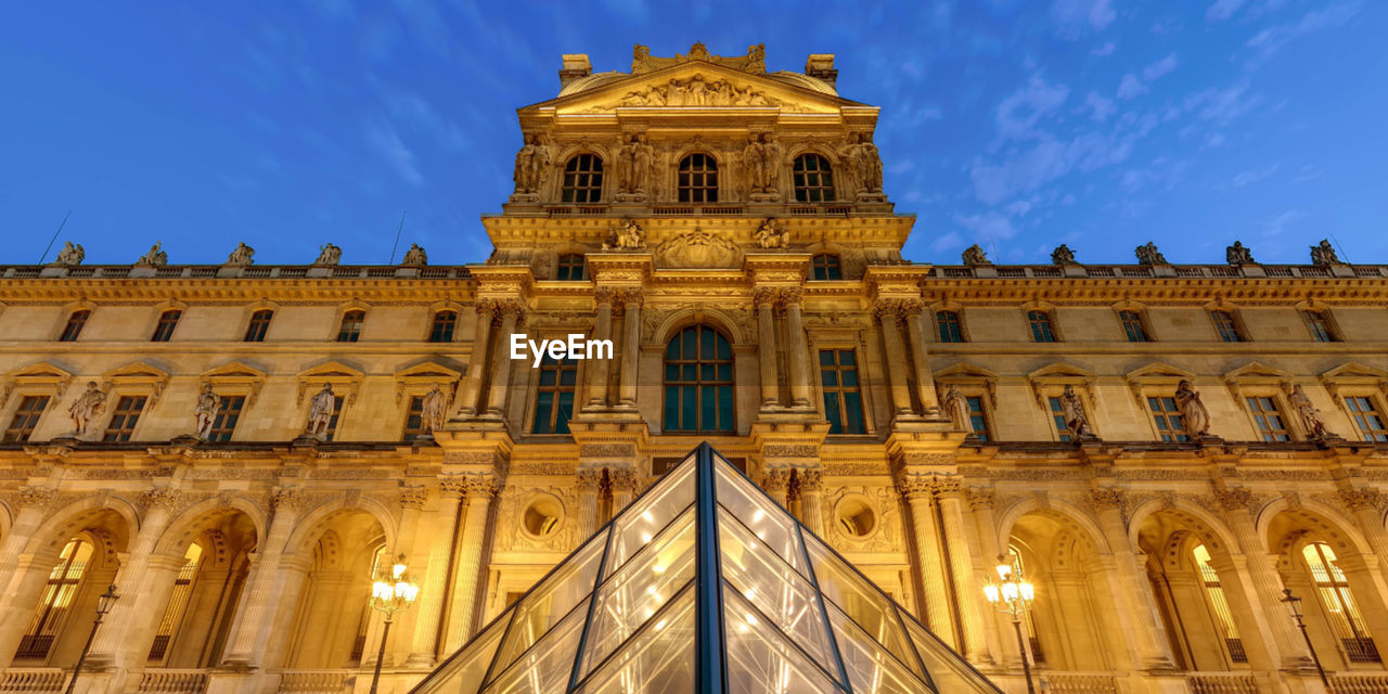 LOW ANGLE VIEW OF ILLUMINATED BUILDING