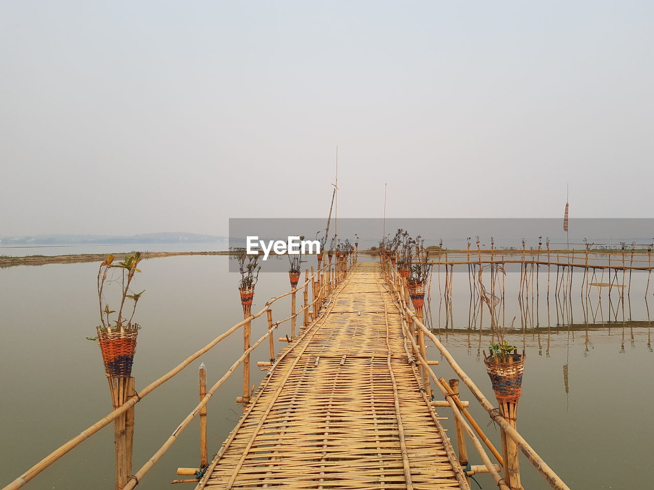 Pier over sea against clear sky