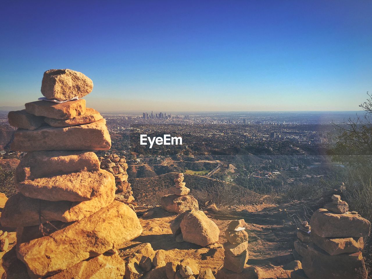 Panoramic view of rocks on landscape against clear sky