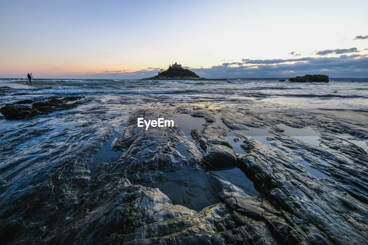 Scenic view of sea against sky during sunset