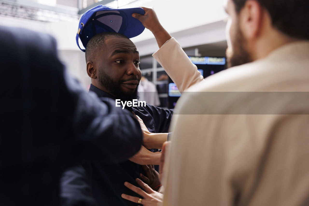 side view of man looking at airport