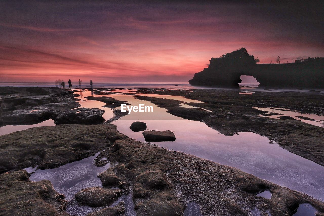 Scenic view of sea against sky at sunset