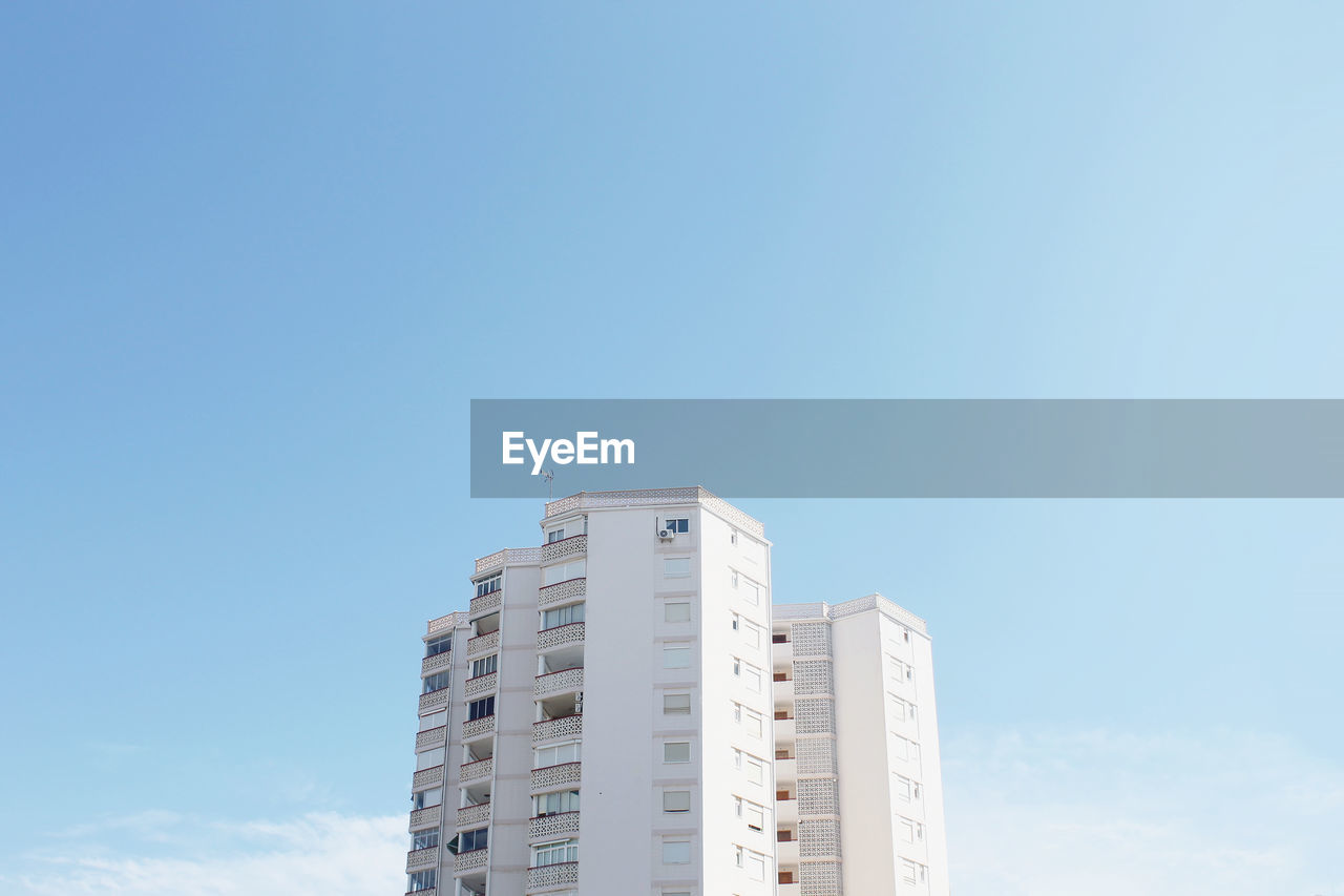 Low angle view of building in city against sky