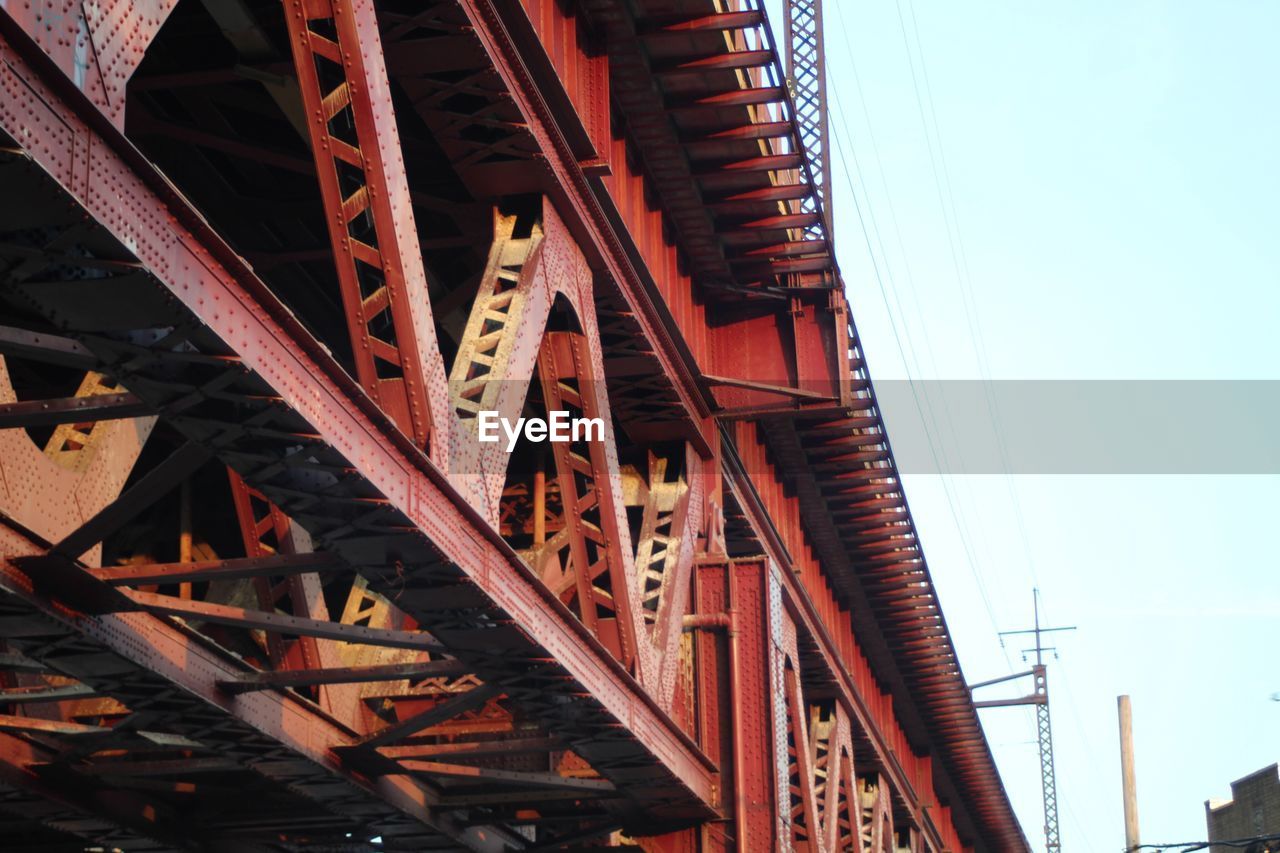 LOW ANGLE VIEW OF BRIDGE AGAINST BLUE SKY