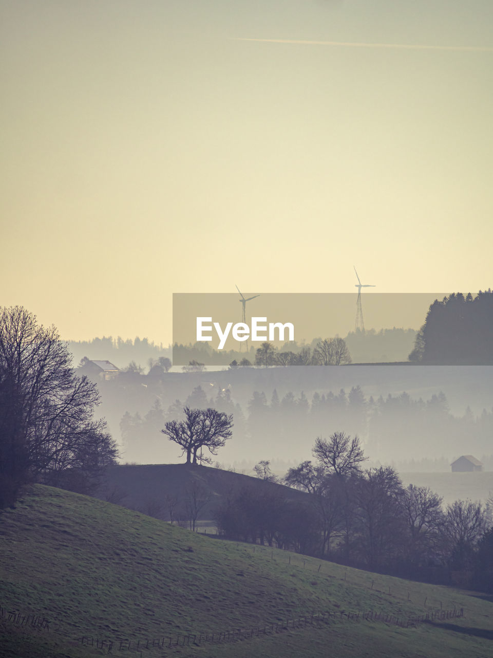 SCENIC VIEW OF FIELD AGAINST SKY AT SUNSET