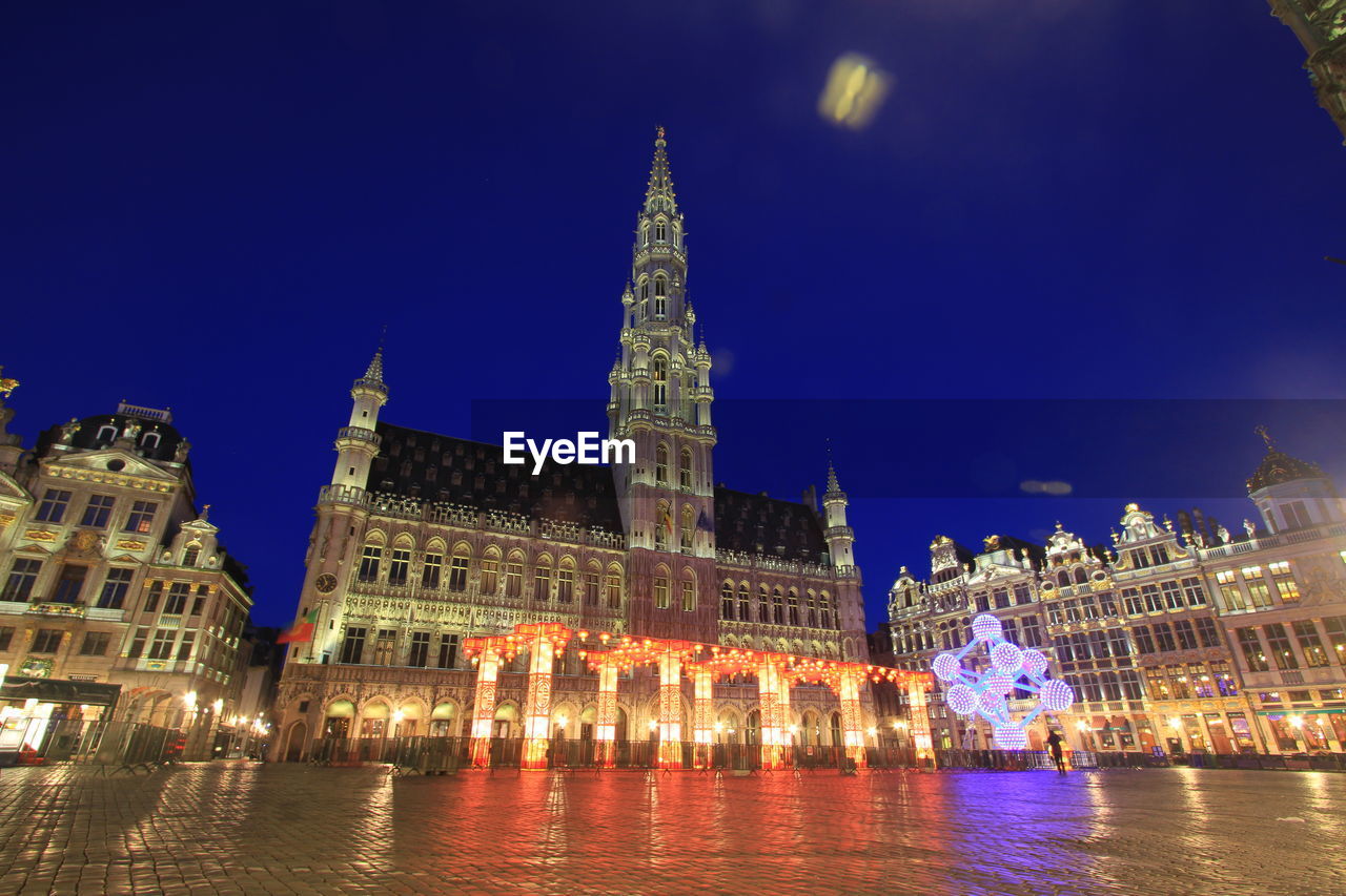 Illuminated buildings in city at night