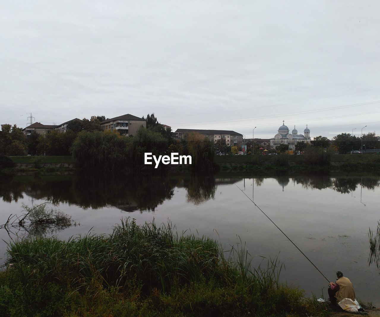 Man fishing in lake
