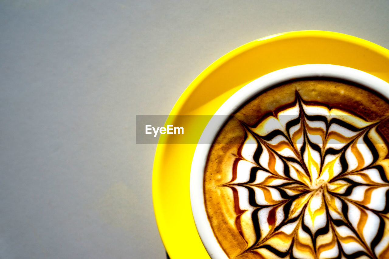 Directly above shot of coffee cup on table