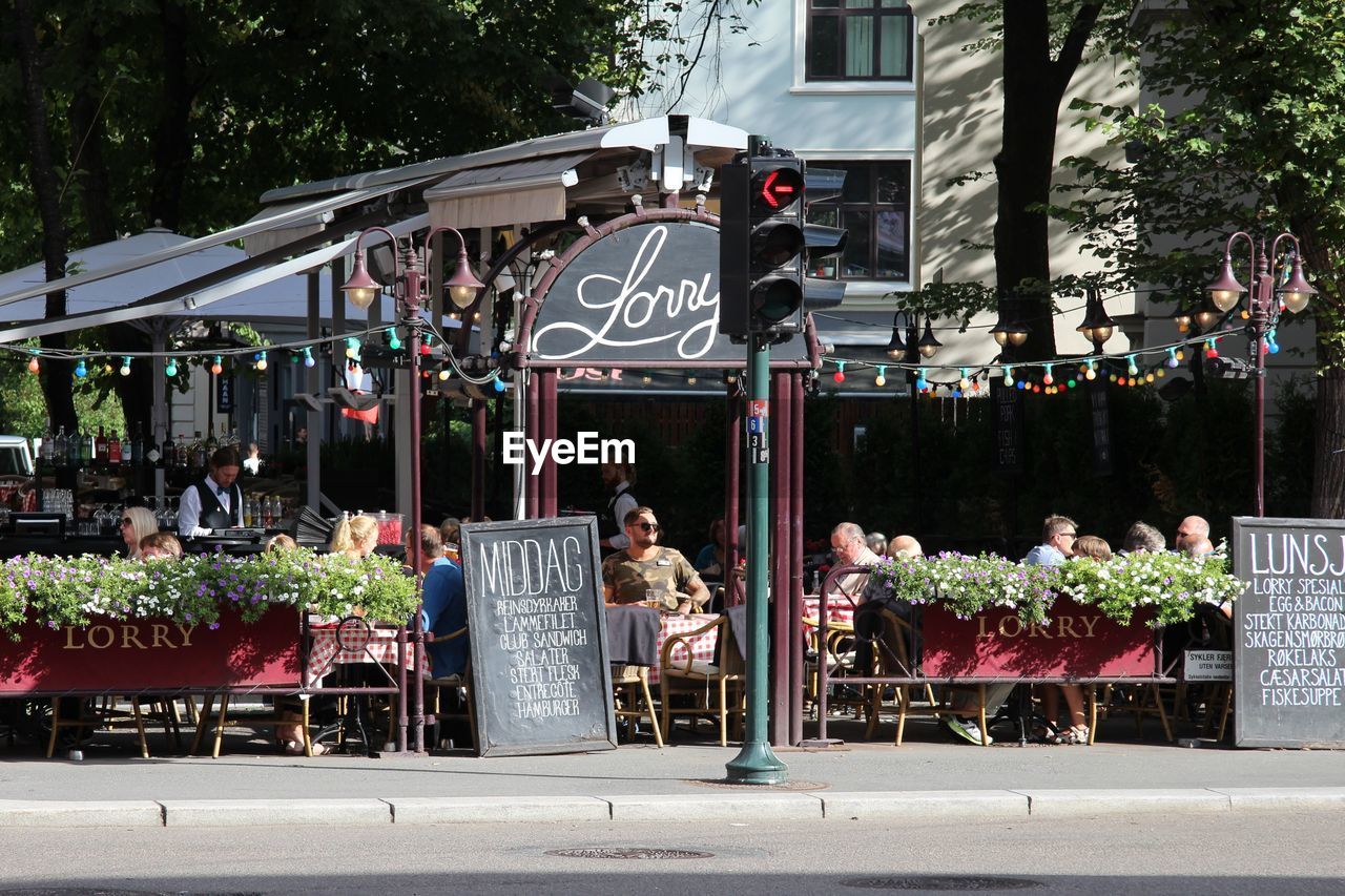 PEOPLE ON STREET IN CITY AT PARK