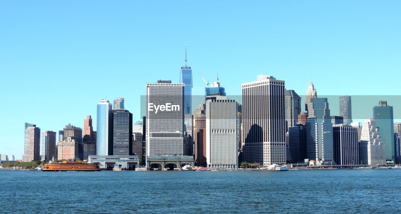 City skyline against blue sky