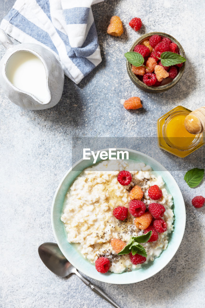 Healthy diet breakfast. oatmeal porridge in ceramic bowl decorated with fresh berries raspberries. 