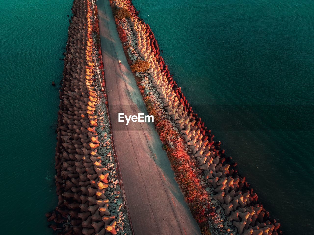 High angle view of pier in sea during sunset