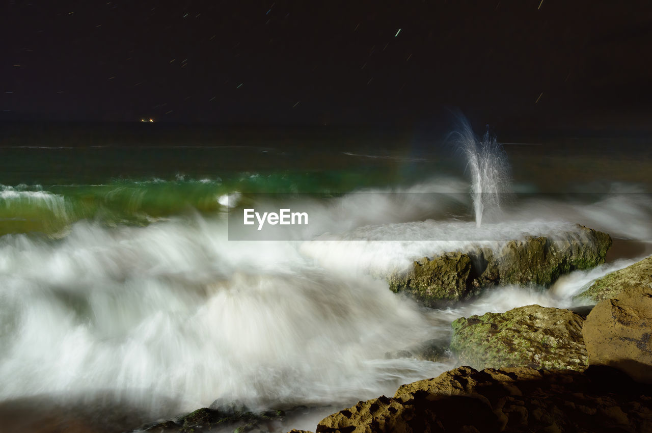 WATER FLOWING THROUGH ROCKS