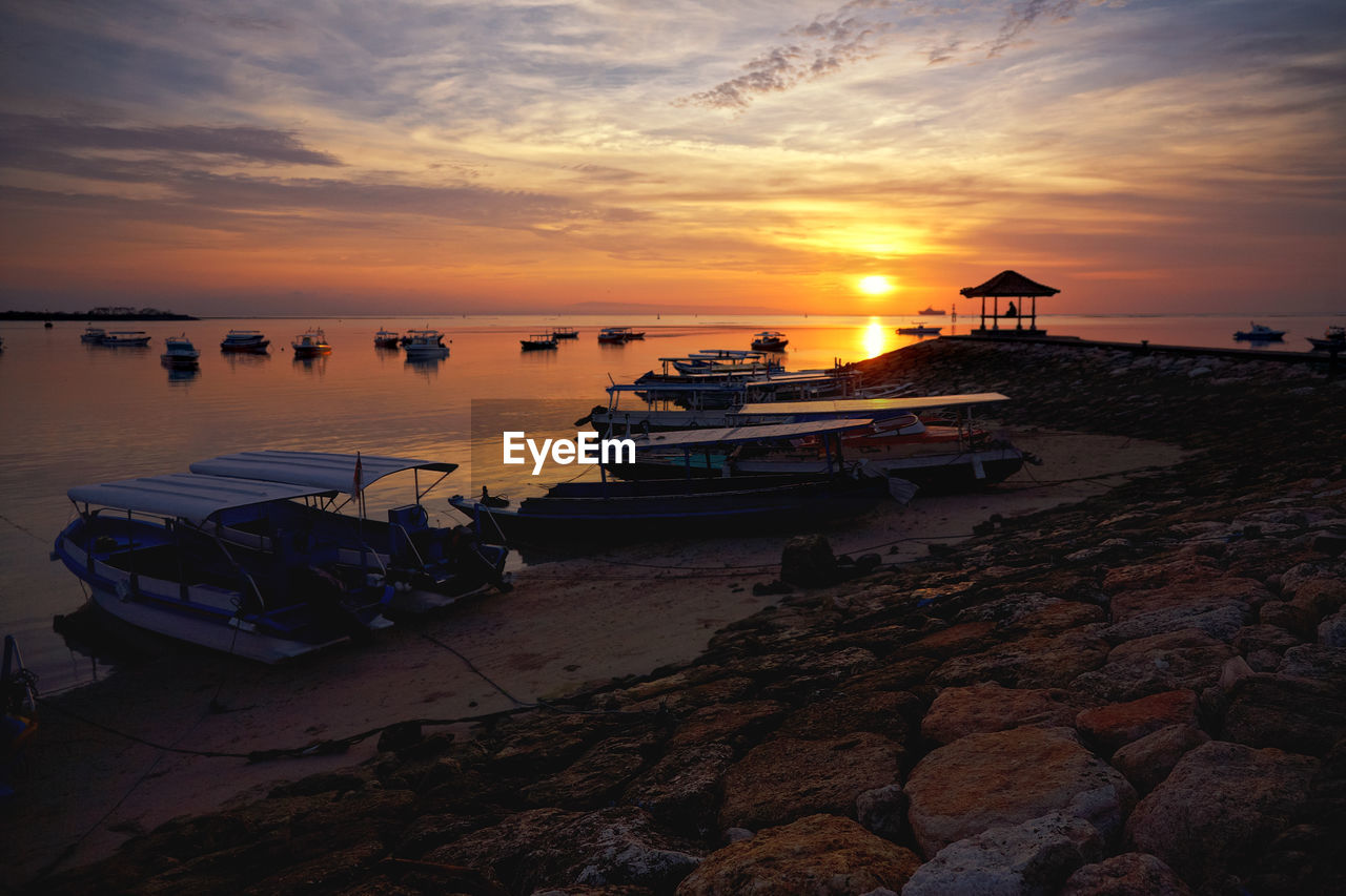 SCENIC VIEW OF SEA AGAINST ORANGE SKY