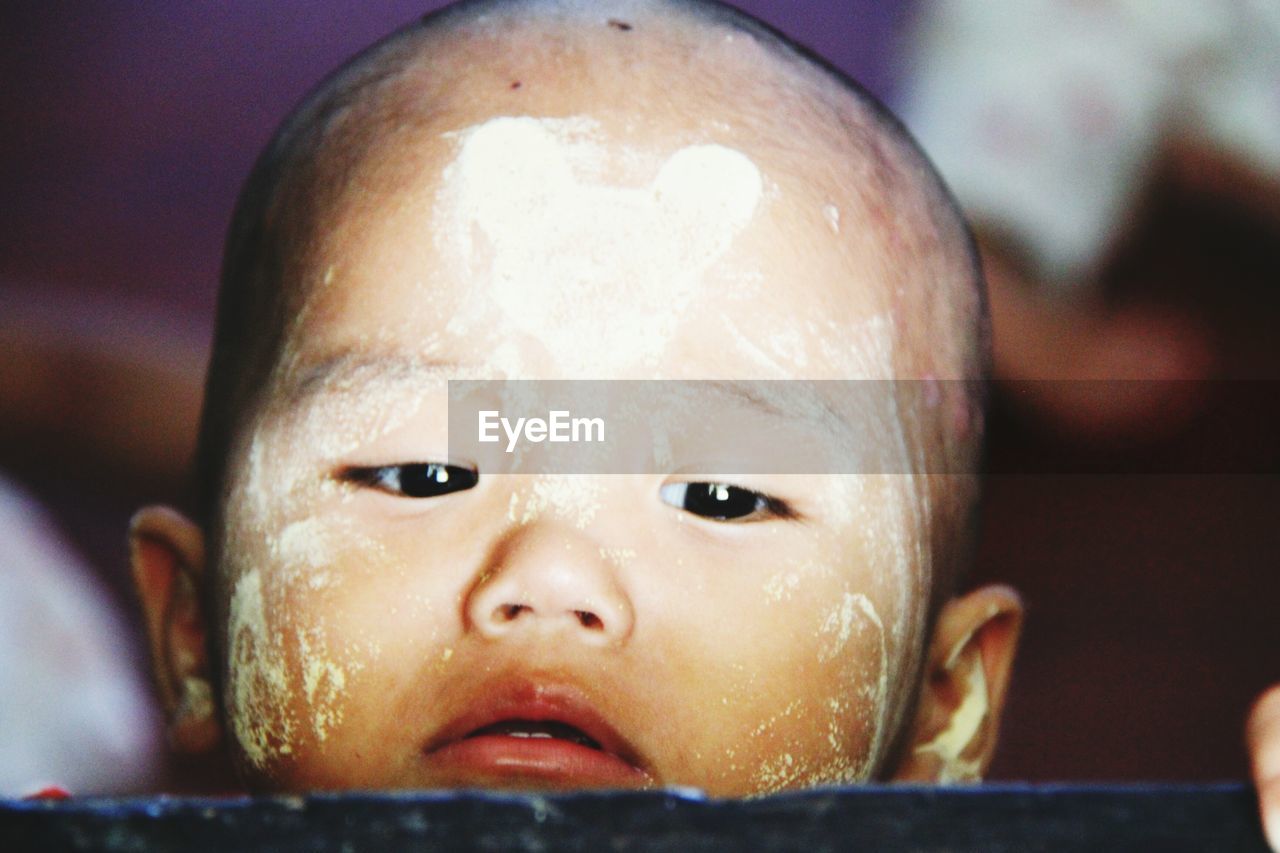 Close-up of cute boy with face paint