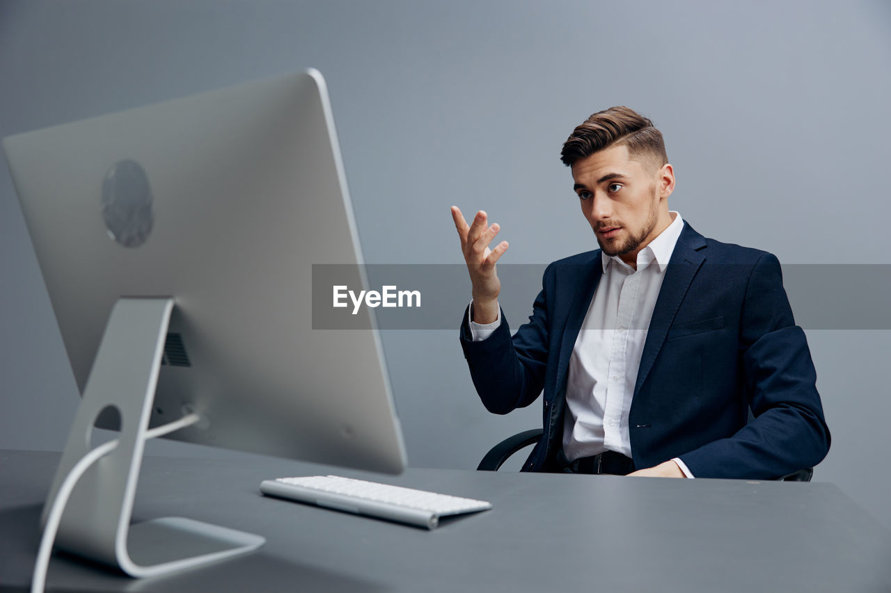 Businessman talking on video conference at office