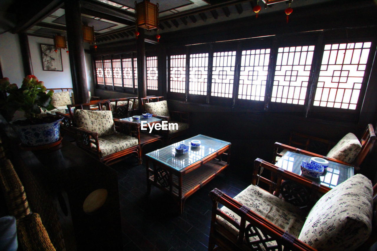 High angle view of tables and chairs in restaurant