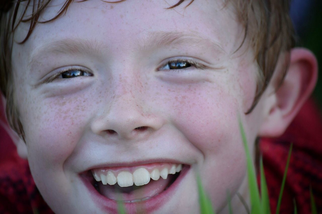 Close-up portrait of smiling boy