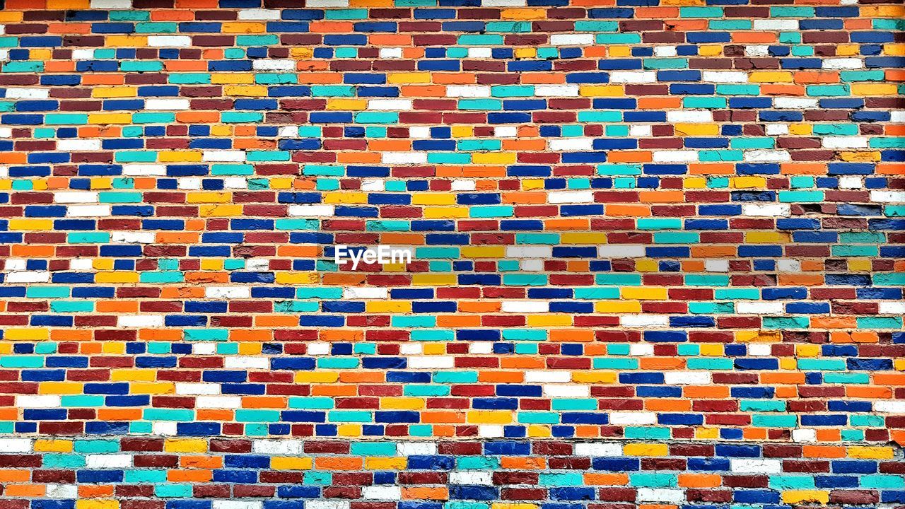 Full frame shot of multi colored brick wall