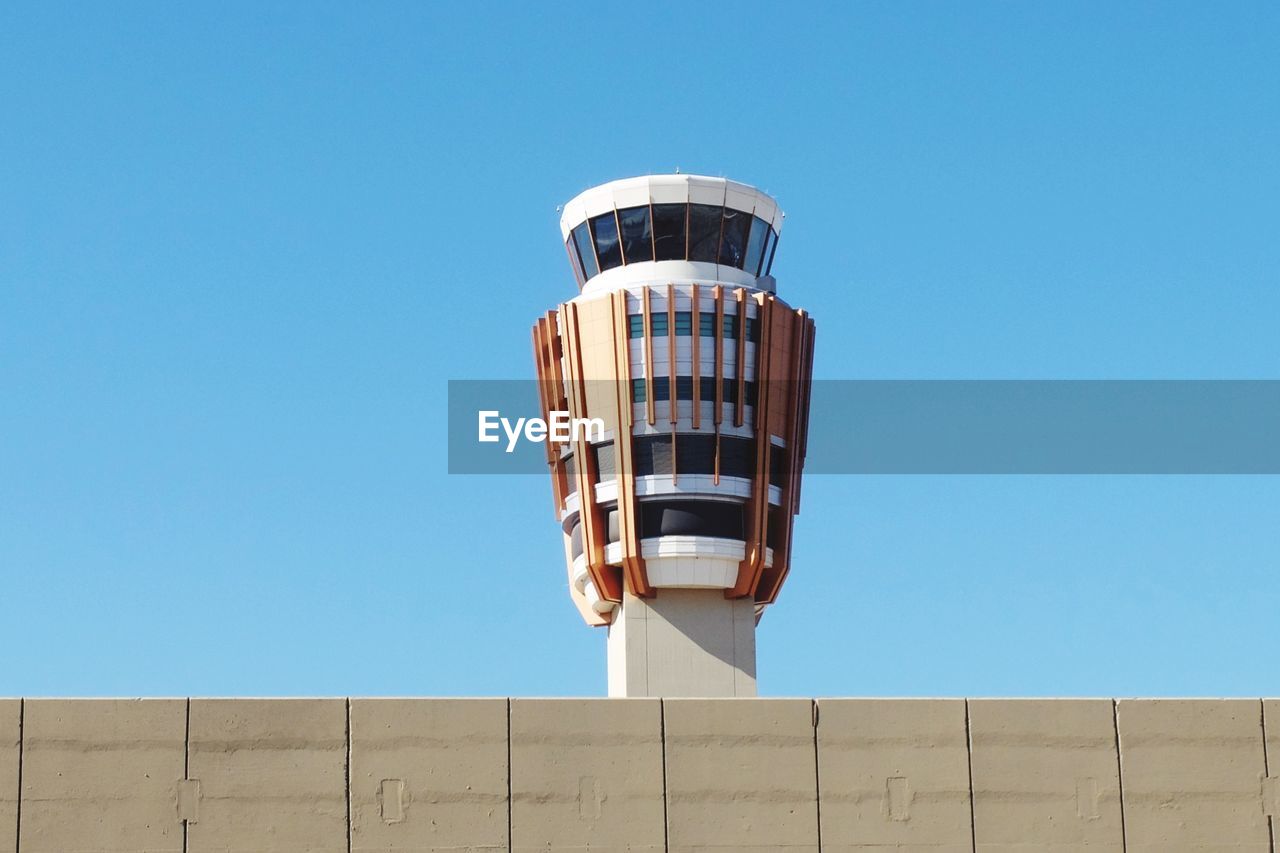 LOW ANGLE VIEW OF BUILT STRUCTURE AGAINST BLUE SKY