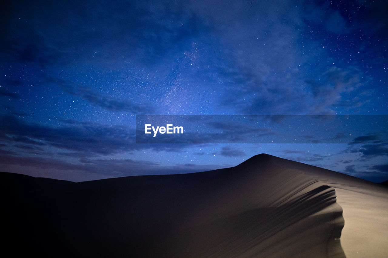 LOW ANGLE VIEW OF DESERT AGAINST SKY