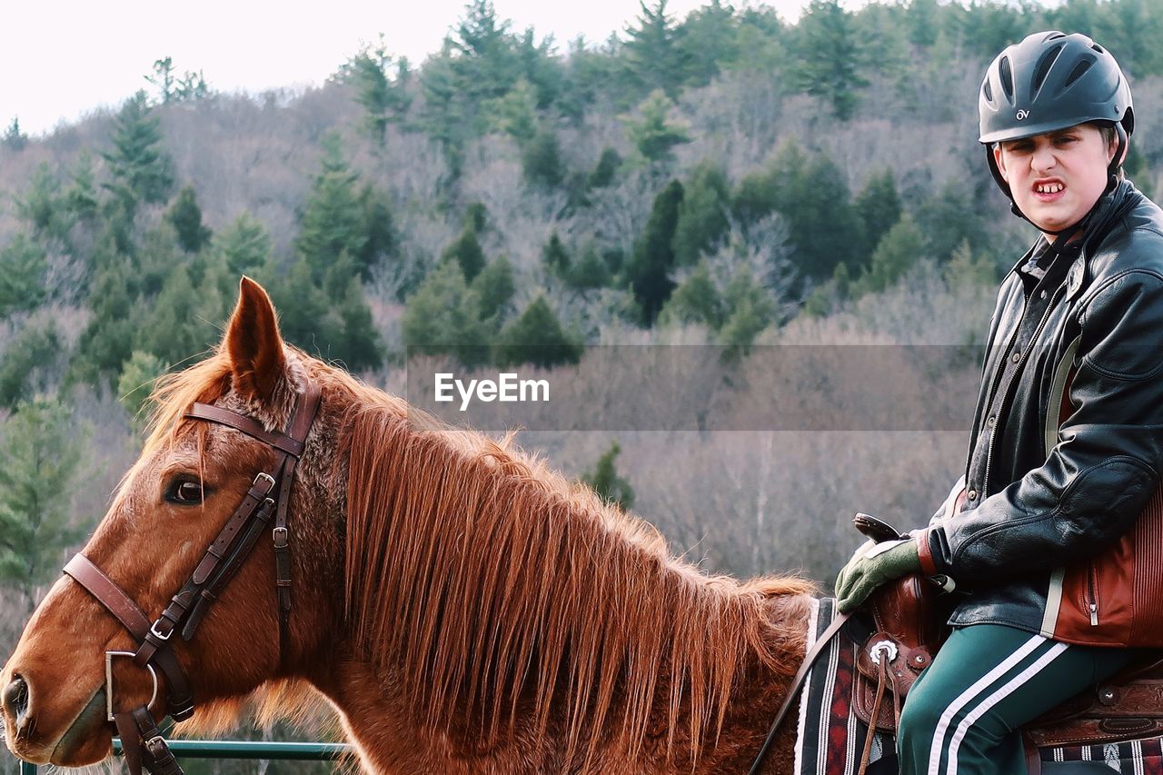 PORTRAIT OF HORSE RIDING