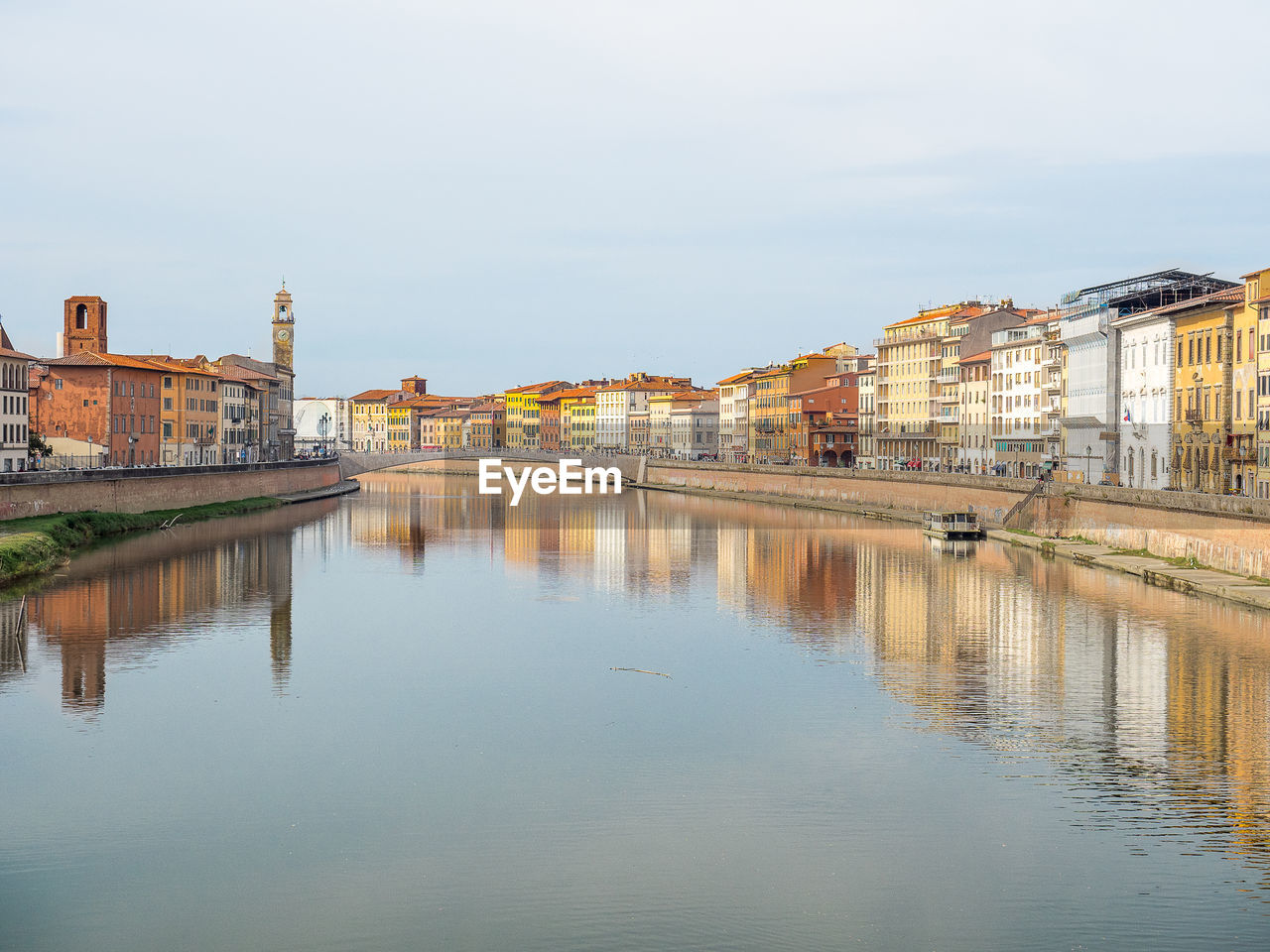 Reflection of buildings in water. pisa, italy