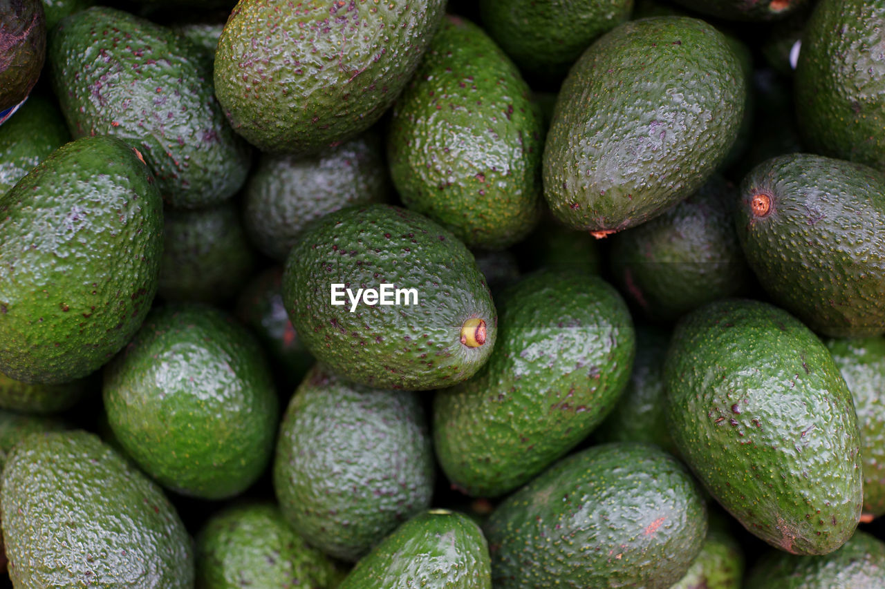 Full frame shot of avocados for sale at market