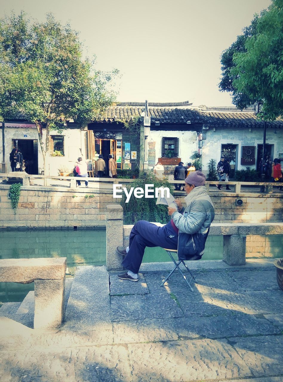 WOMAN PLAYING IN PARK