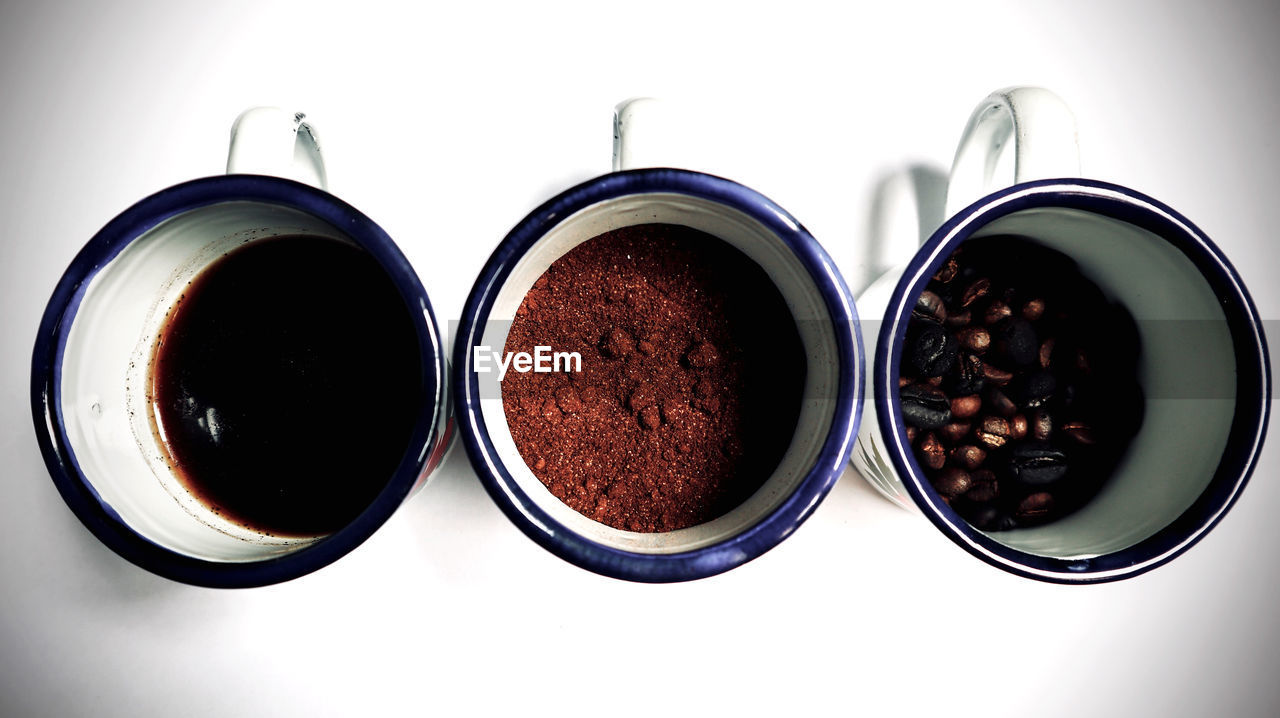 DIRECTLY ABOVE SHOT OF COFFEE BEANS IN CUP