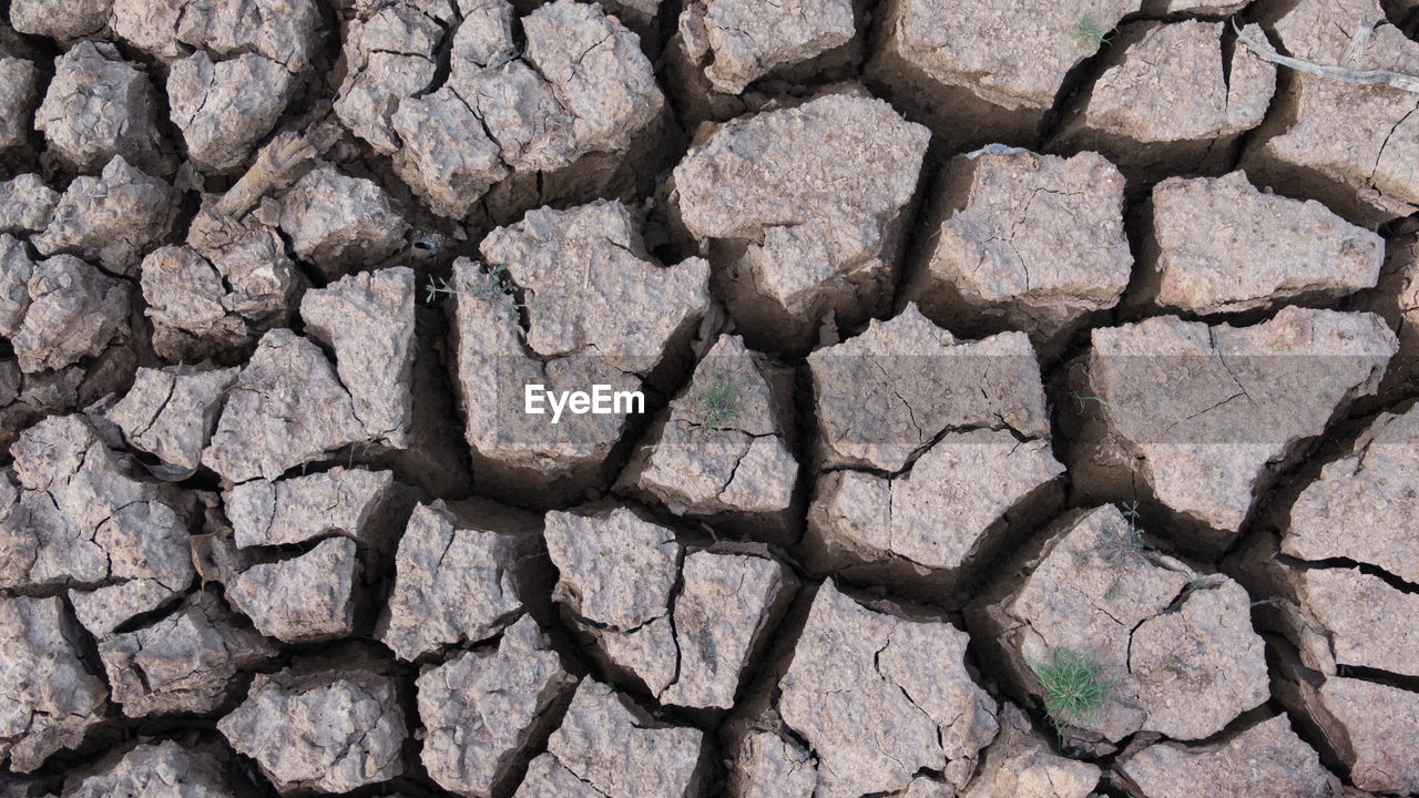 Full frame shot of drought surface during sunny day