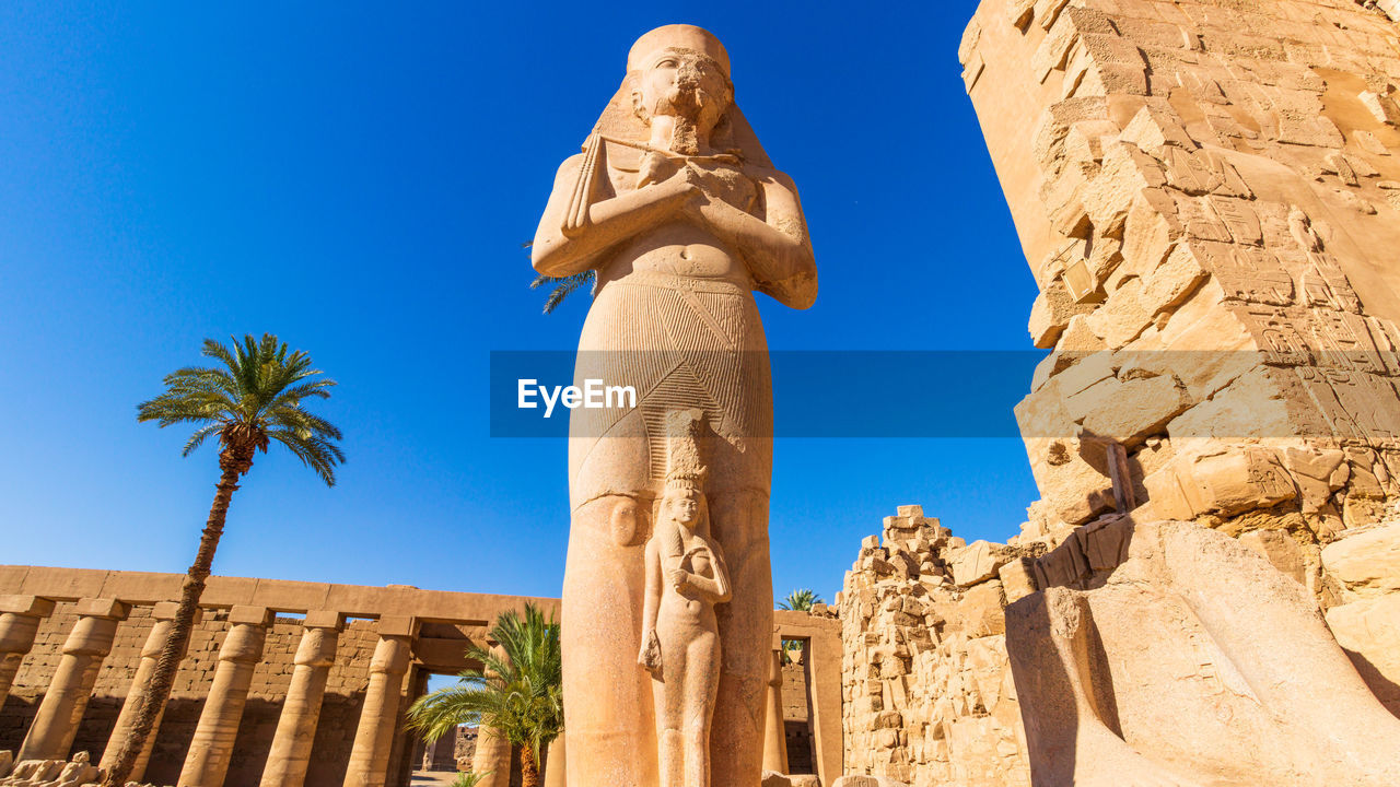 low angle view of statue against clear blue sky