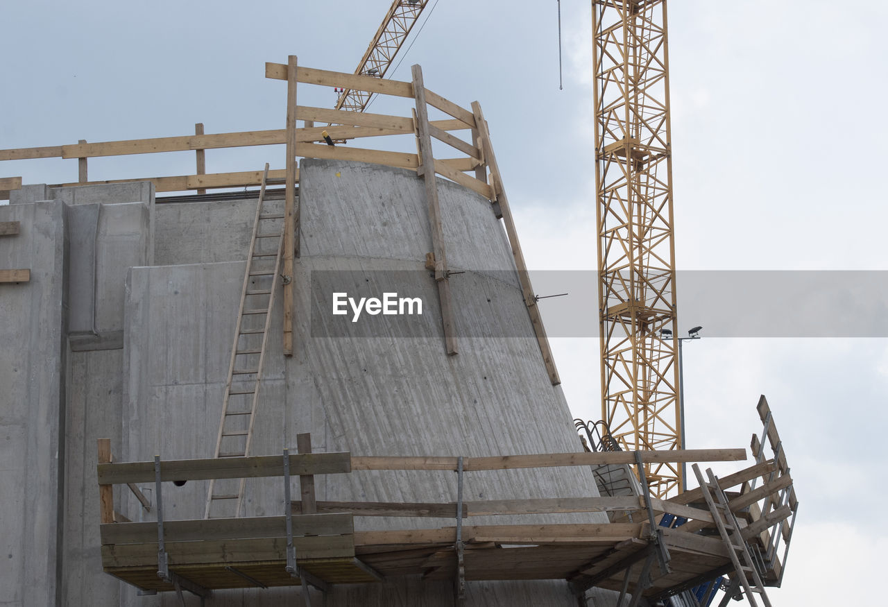 industry, architecture, business finance and industry, sky, built structure, construction industry, vehicle, mast, nature, no people, power generation, crane - construction machinery, outdoors, construction site, business, day, machinery, cloud, occupation