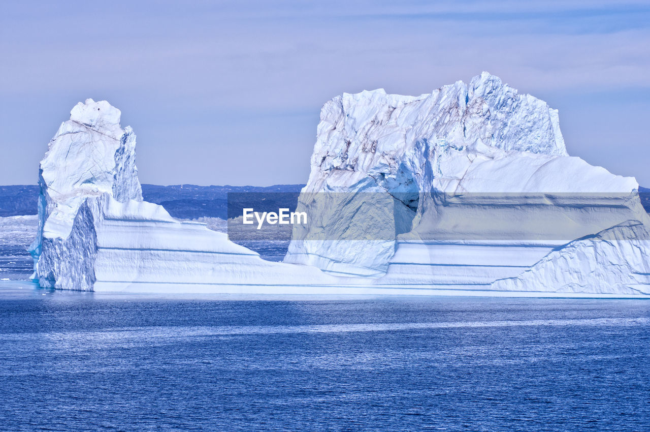 Scenic view of frozen sea against sky