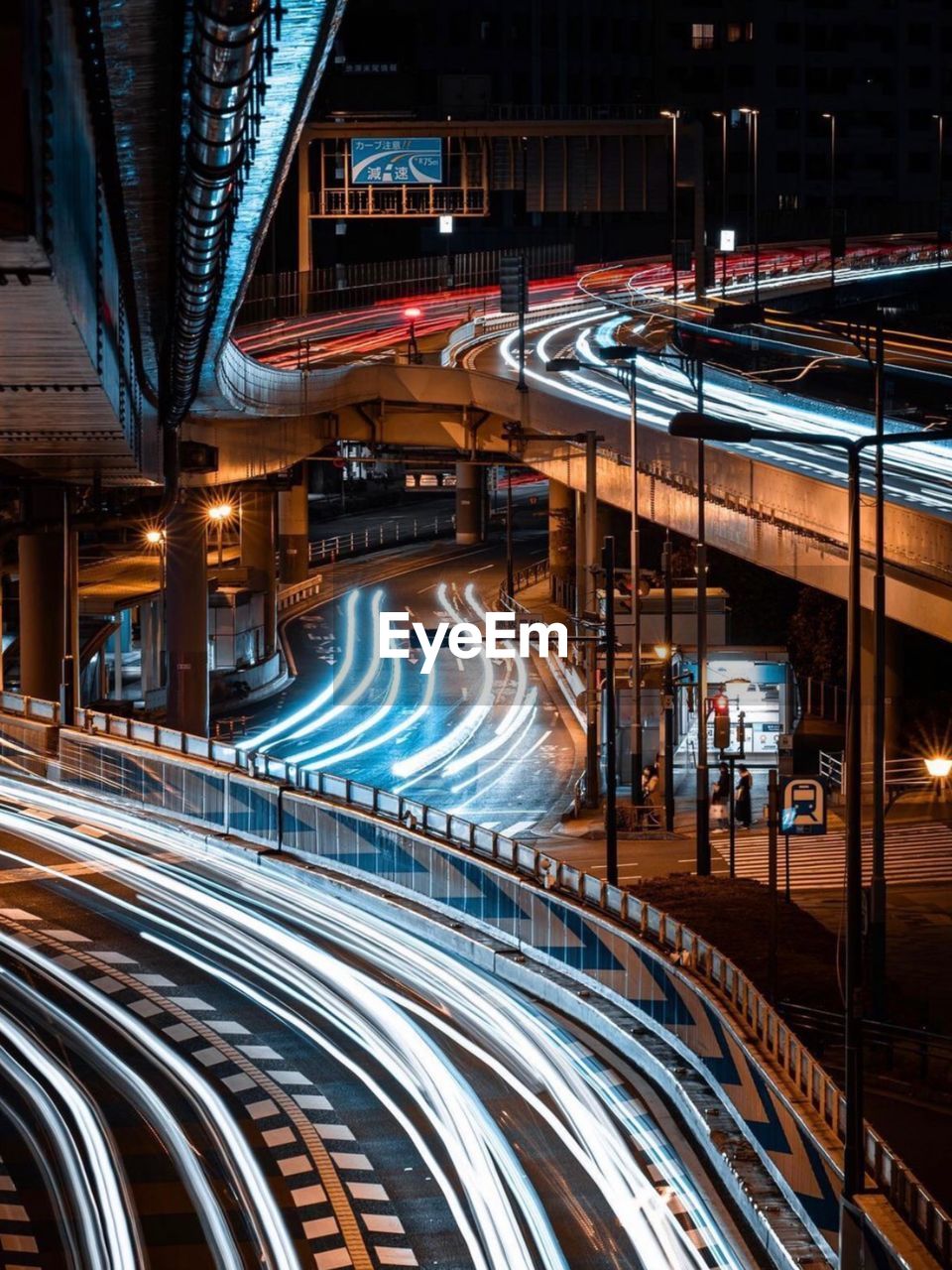 Light trails on highway in city at night