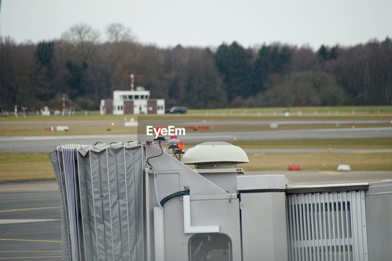 Cropped image of passenger boarding bridge at runway