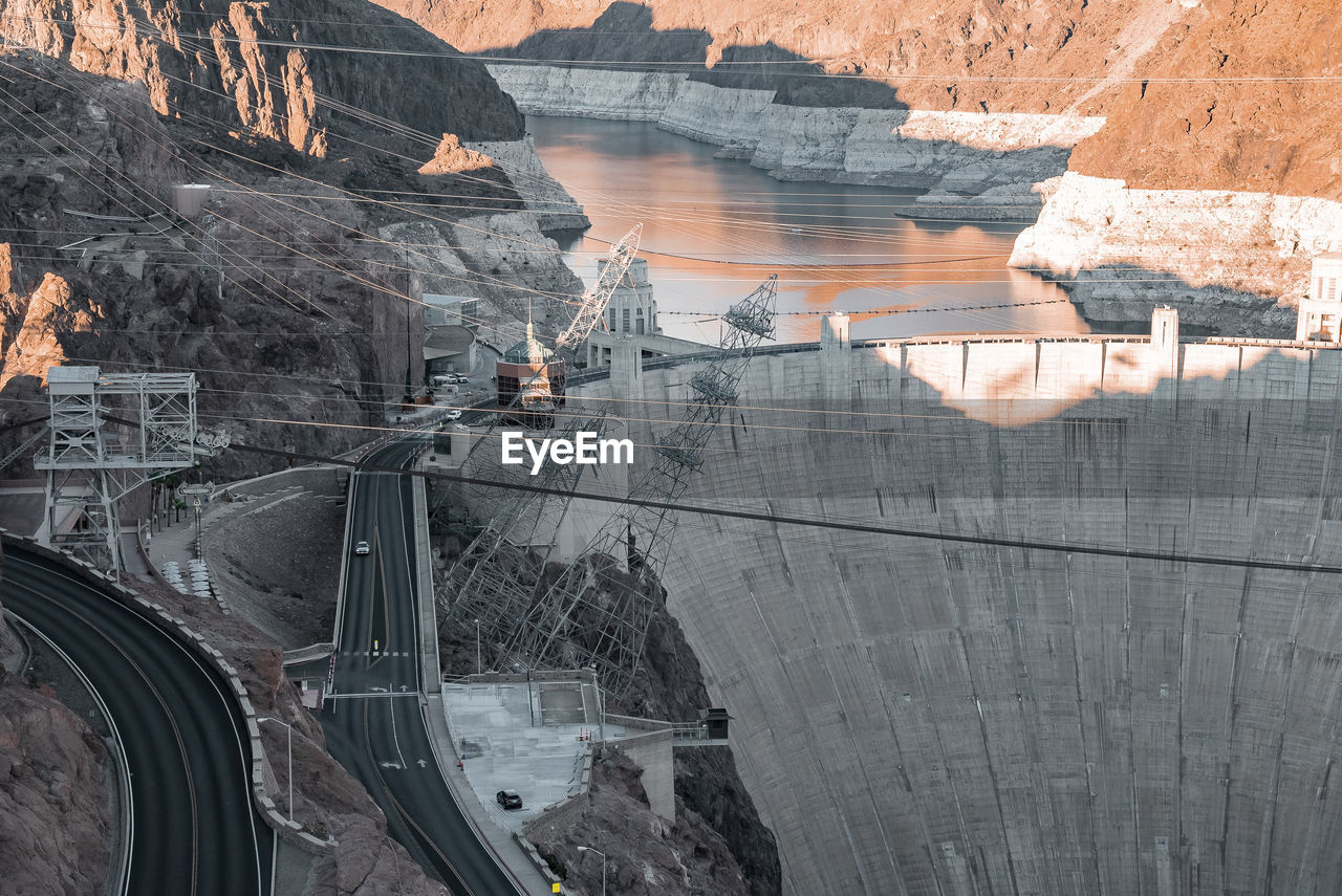 Aerial view of cables over arch bridge and hoover dam