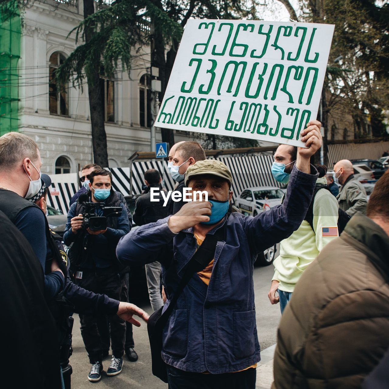 GROUP OF PEOPLE ON STREET