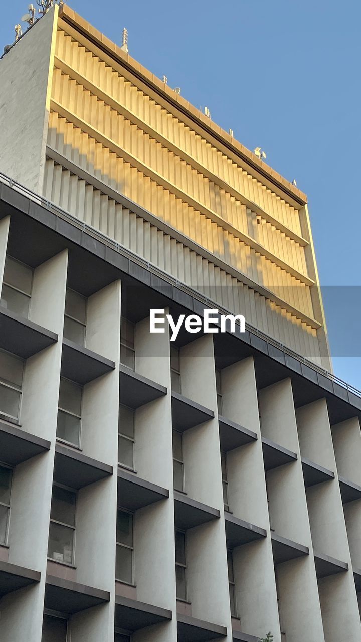 architecture, building exterior, built structure, facade, city, building, sky, no people, low angle view, tower block, skyscraper, business, window, office building exterior, office, outdoors, business finance and industry, nature, landmark, brutalist architecture