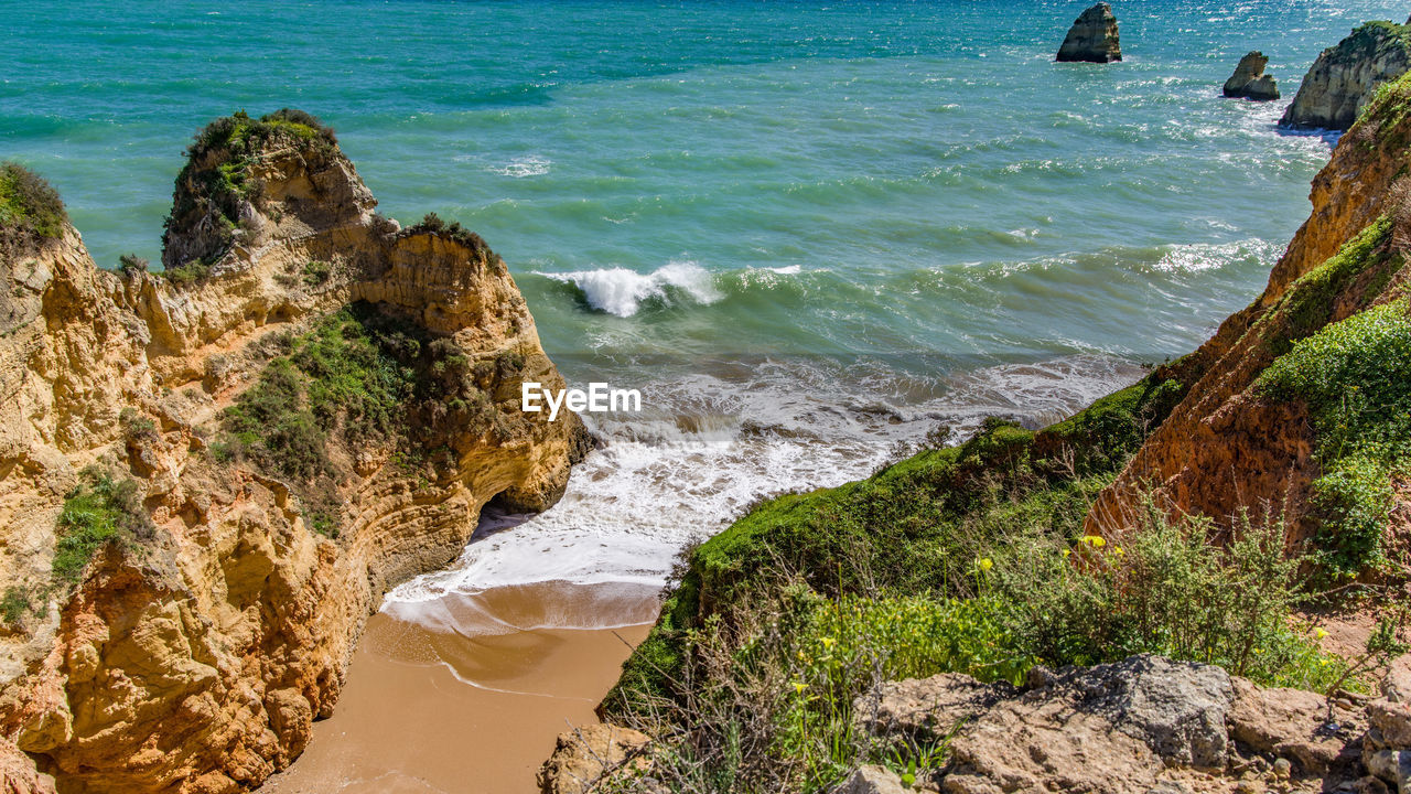 Scenic view of rocks on beach