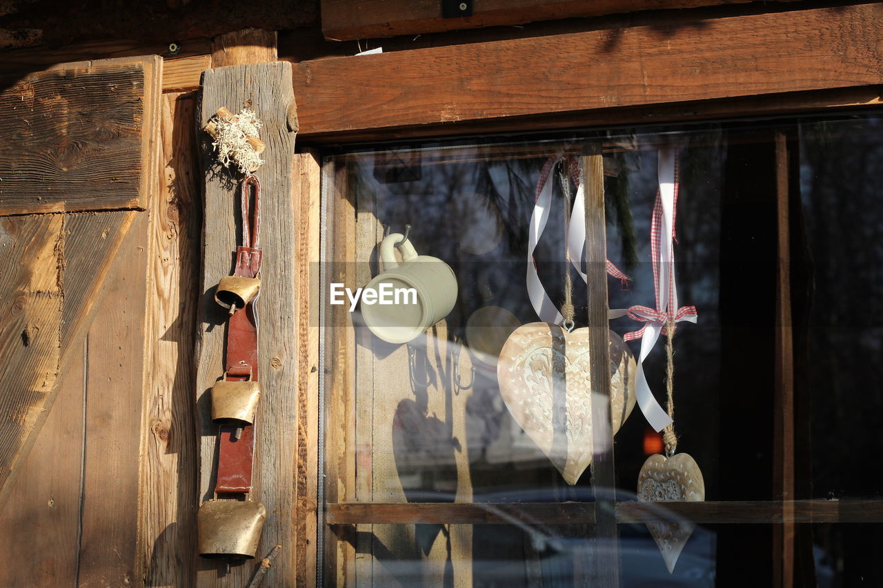 Close-up of clothes hanging on glass window