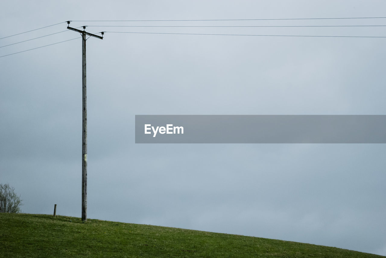 LOW ANGLE VIEW OF ELECTRICITY PYLON AGAINST SKY