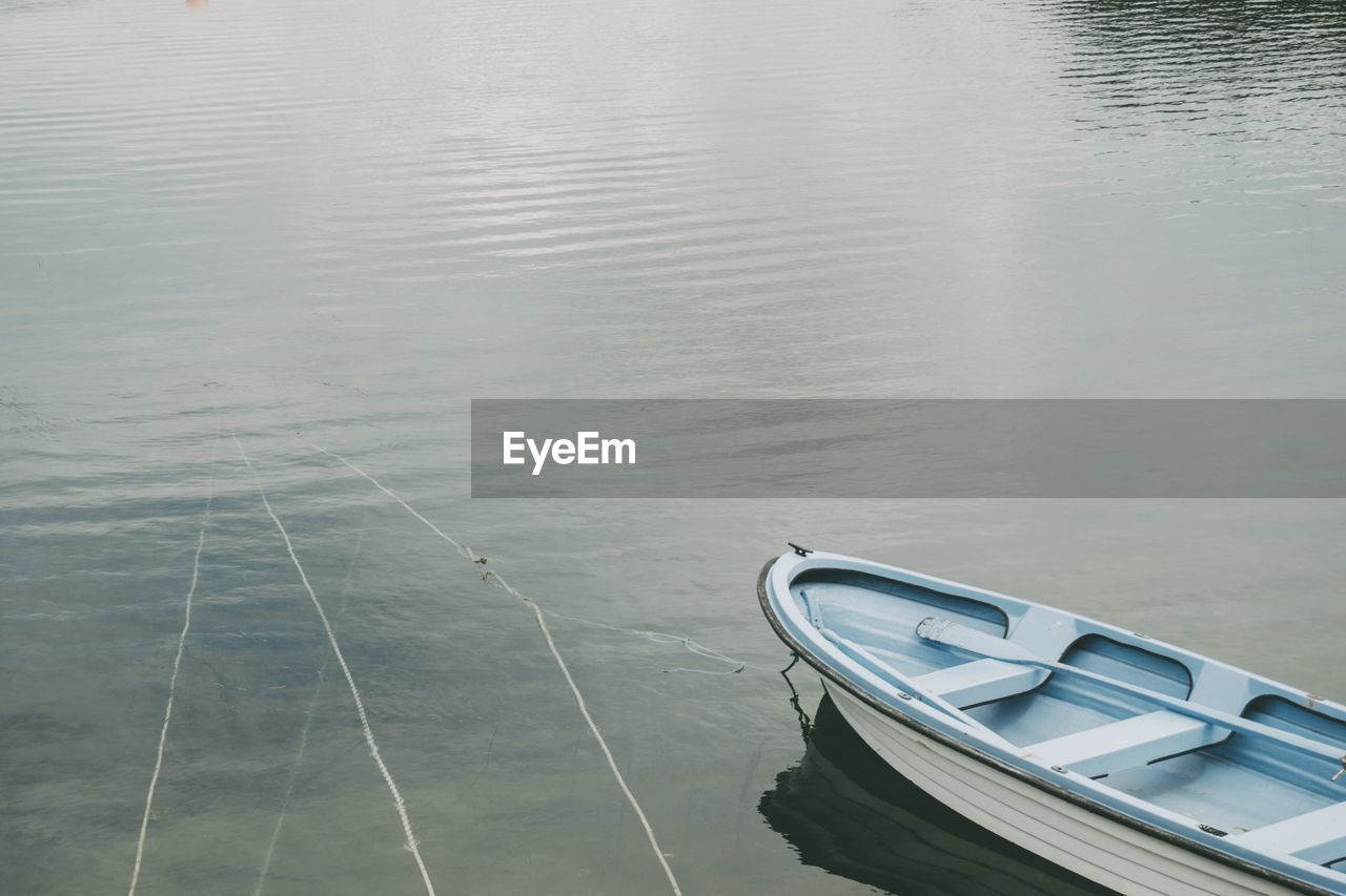 High angle view of boat moored in lake