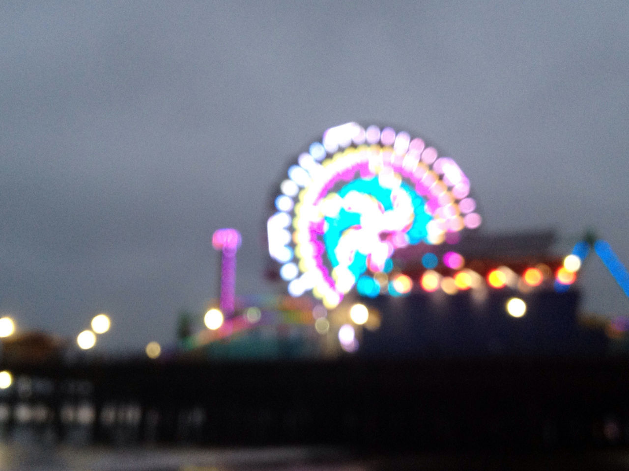 LOW ANGLE VIEW OF ILLUMINATED LIGHTS IN DARK