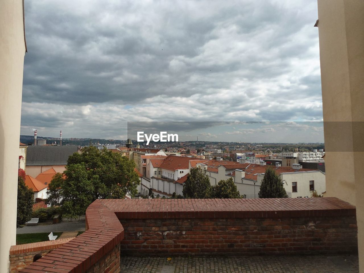 RESIDENTIAL BUILDINGS AGAINST CLOUDY SKY