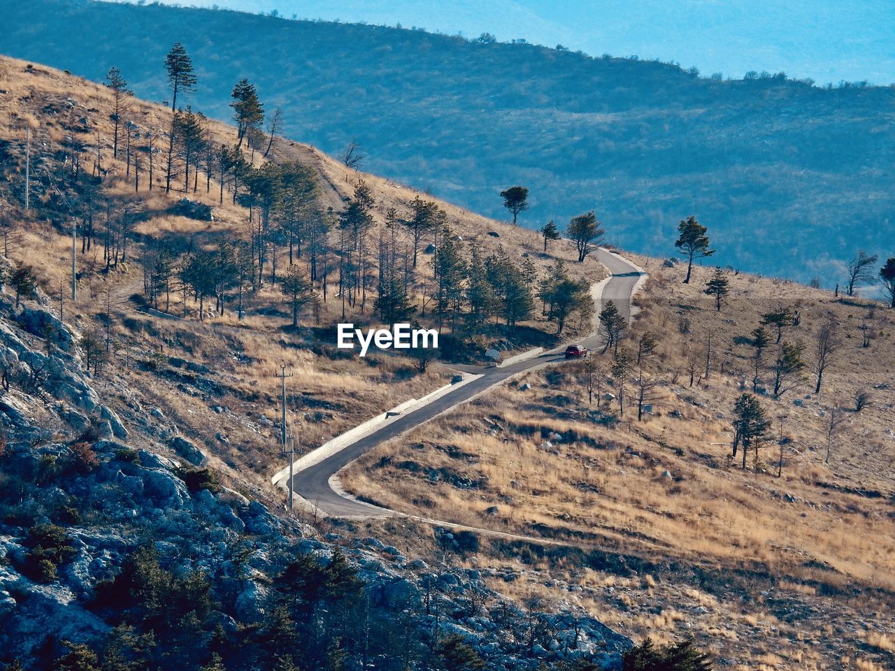 High angle view of road amidst mountains