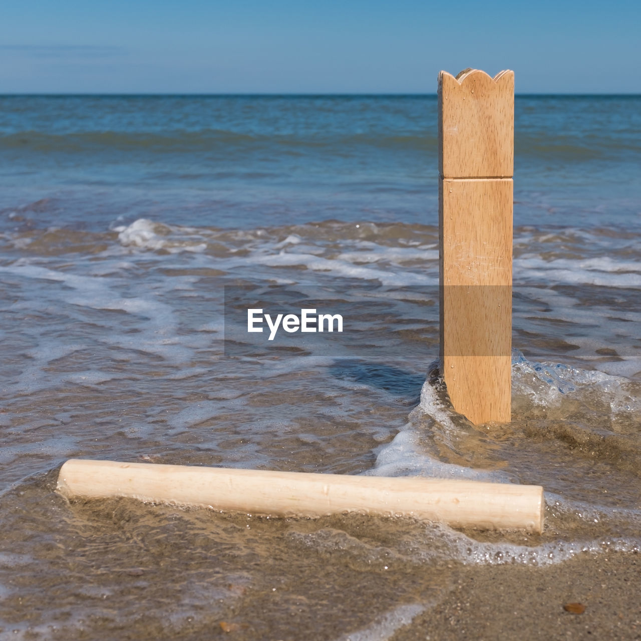 WOODEN POST IN SEA