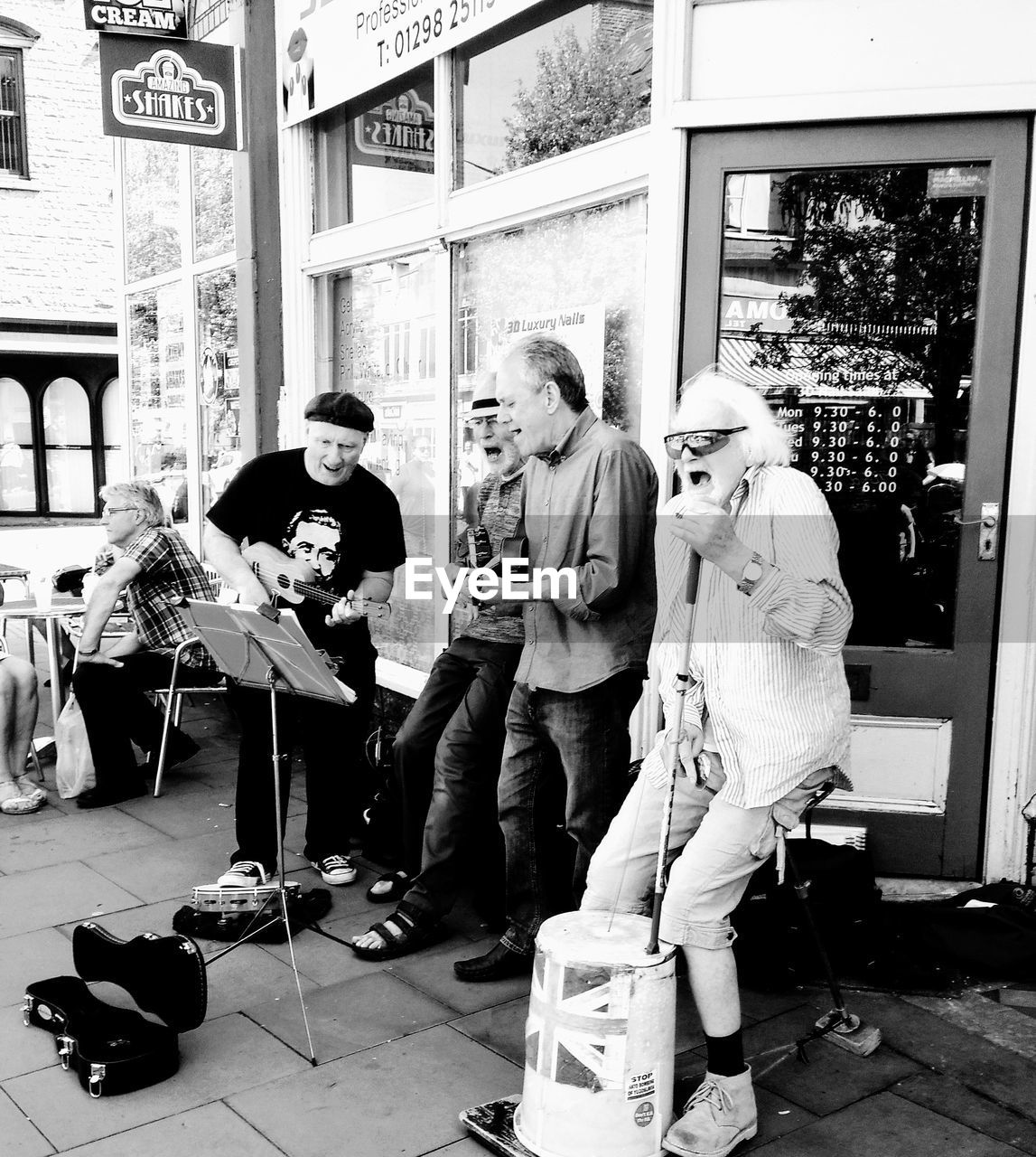 GROUP OF PEOPLE AT OUTDOOR MARKET