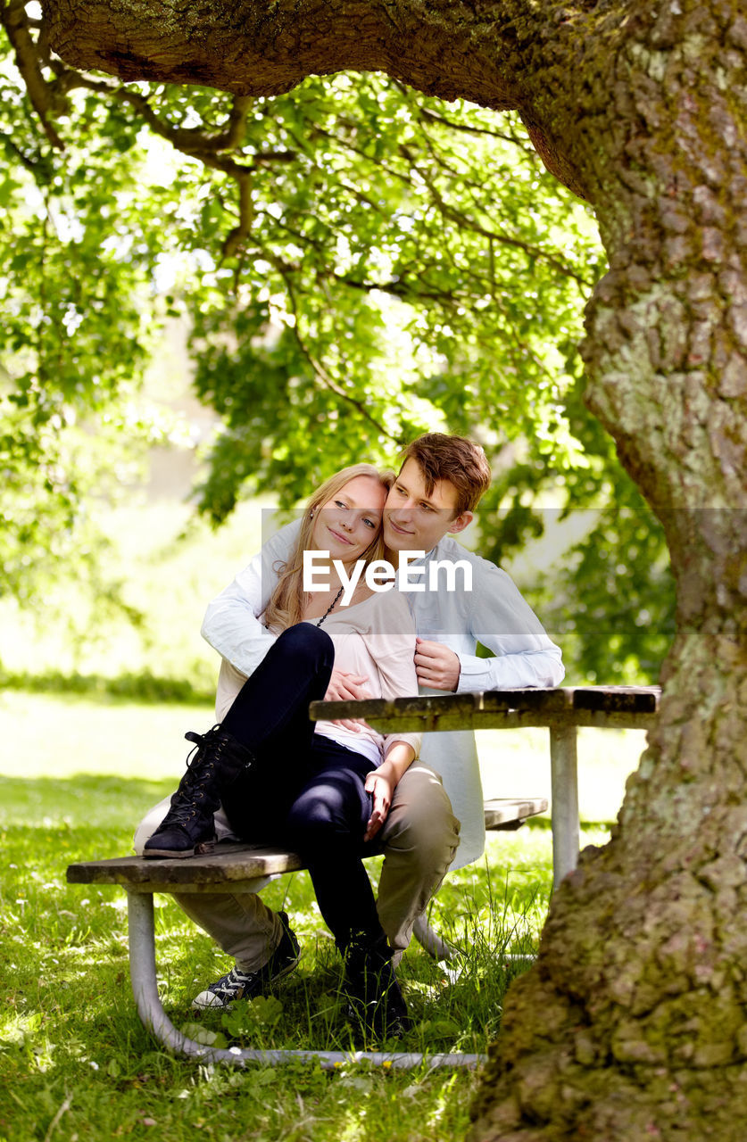 adult, two people, women, togetherness, sitting, emotion, men, plant, positive emotion, love, happiness, nature, ceremony, smiling, tree, young adult, full length, female, leisure activity, casual clothing, bonding, relaxation, lifestyles, bench, day, romance, park, outdoors, park - man made space, seat, grass, enjoyment, affectionate, cheerful, embracing, green, food and drink, person, friendship, portrait photography, clothing, footwear, communication, looking