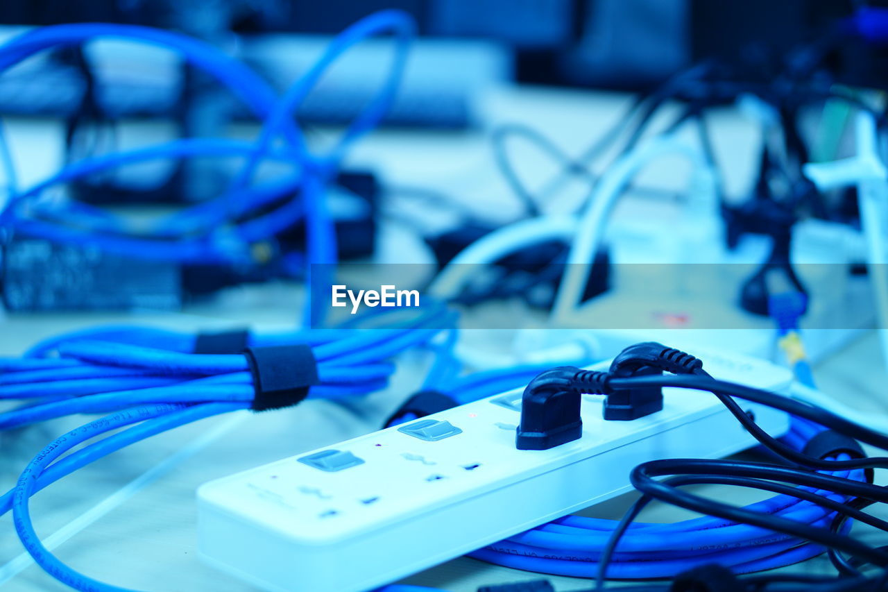 Close-up of electric plugs on table